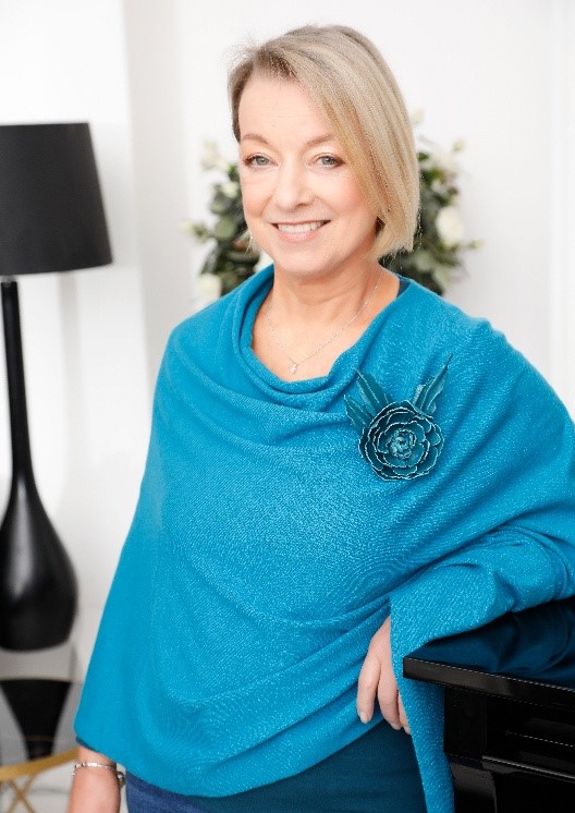 stress picture Woman in teal shawl with floral brooch