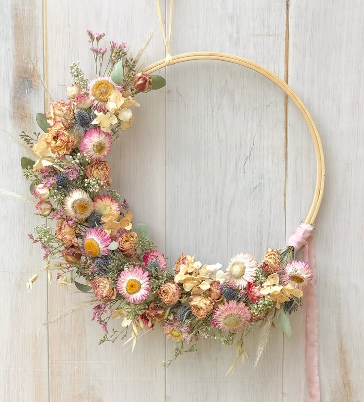 Everlasting Wreath-Making Workshop Pastel dried flower wreath on wooden wall